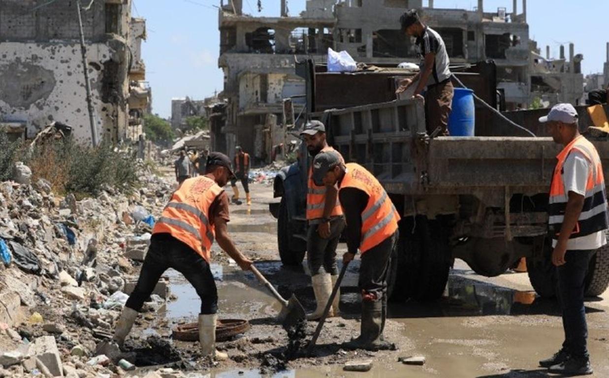 Sanitation workers drain sewage among rubble to stop disease. Help Gazans in the heat survive skin infections via TRX.