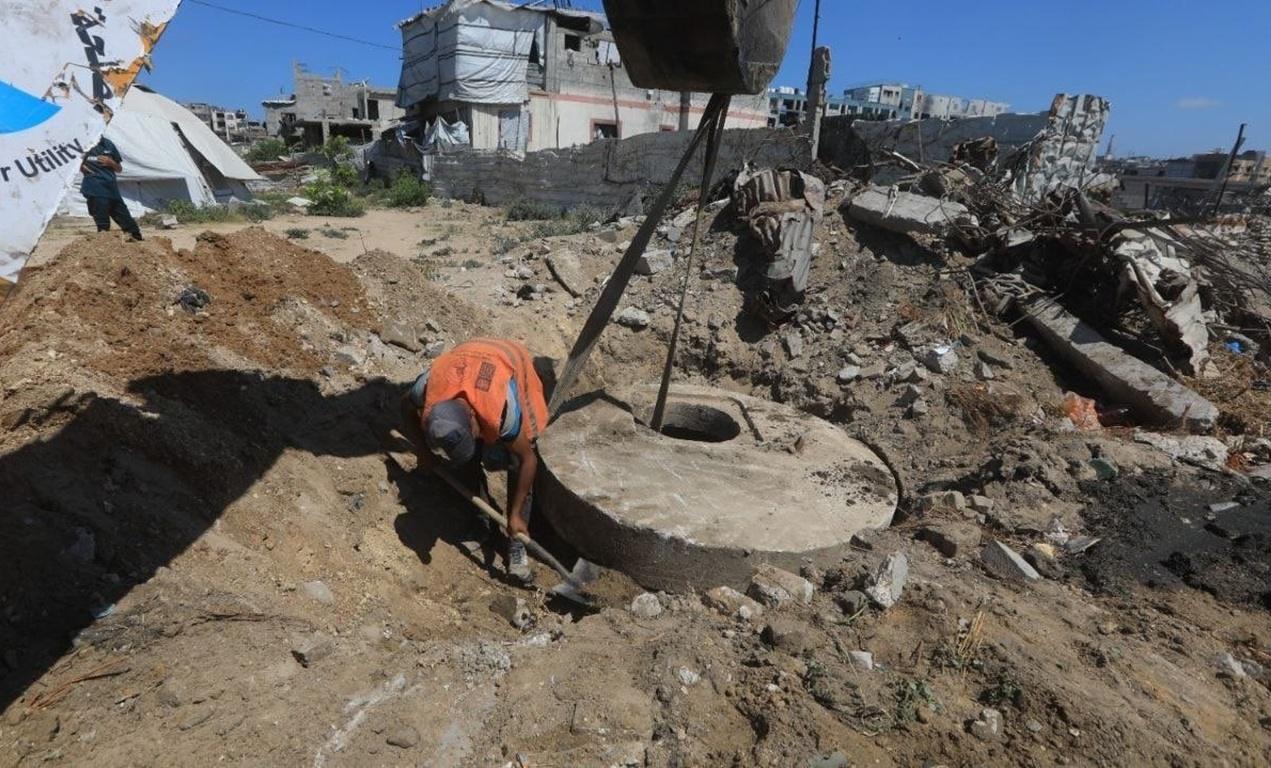 Draining stagnant sewage in Gaza heat and improving environmental hygiene. LTC donations to Islamic Donate Charity prevent disease hazards.