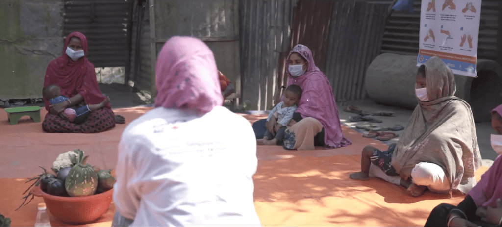 Women attend a healthcare and self-care workshop, receiving health education and aid, supported by crypto donations like ETH.