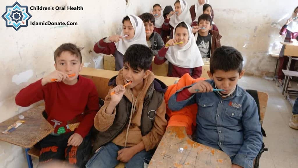 Children learning to brush their teeth, receiving dental kits and education for a cavity-free future. BTC donations provide essential oral care.