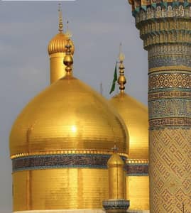 Golden domes and ornate minaret of an Islamic shrine, symbolizing donation opportunities supported by XRP for Islamic relief.