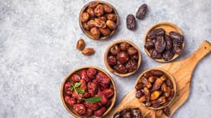 Various types of dates in wooden bowls, symbolizing healthy Iftar meals and Ramadan charity, with crypto donations processed via BNB.