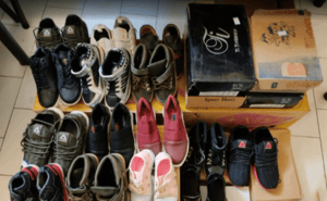 Assortment of new shoes for children, symbolizing crypto-funded educational aid and back-to-school support, sponsored by a generous donor using ETH.