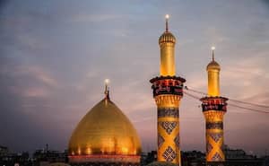 Golden dome and minarets of a mosque against a twilight sky. Crypto donations in BTC facilitate charitable giving.