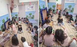 Children sitting on mats receiving bowls of food, a service made possible by crypto donations like BTC.