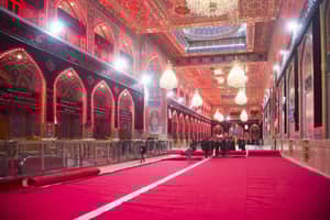 Interior of a grand hall with red carpets and ornate decorations, people walking on the carpet. Crypto donation for Nazr Mola and Kunde ki Niyaz via ETH.