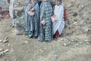 Three women receive meat donations, distribution of Qurbani through modern cryptocurrency like USDT, aiding needy Muslim communities in charitable endeavors.