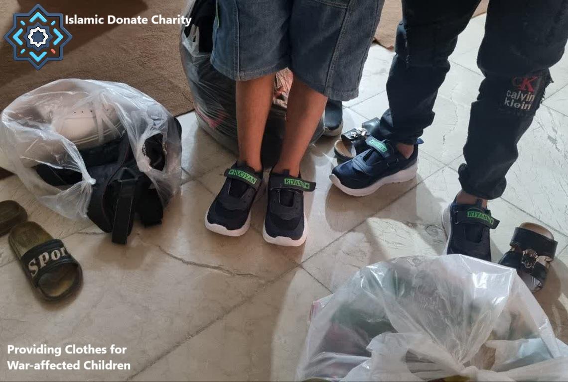 Children wearing new shoes and surrounded by bags of donated clothes, ready for distribution for war-affected children. Donation via crypto like SOL.