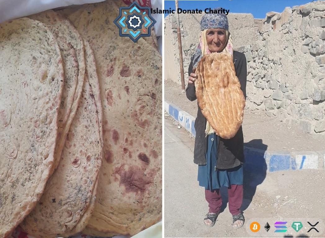 An elderly woman holds Iftar food in a village camp. Zakat in Ramadan gives fresh bread to families in need via LTC.