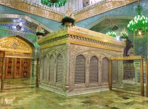 Ornate mausoleum interior with Islamic calligraphy, green marble floors, and intricate silver tomb. Supports crypto donations with USDT.