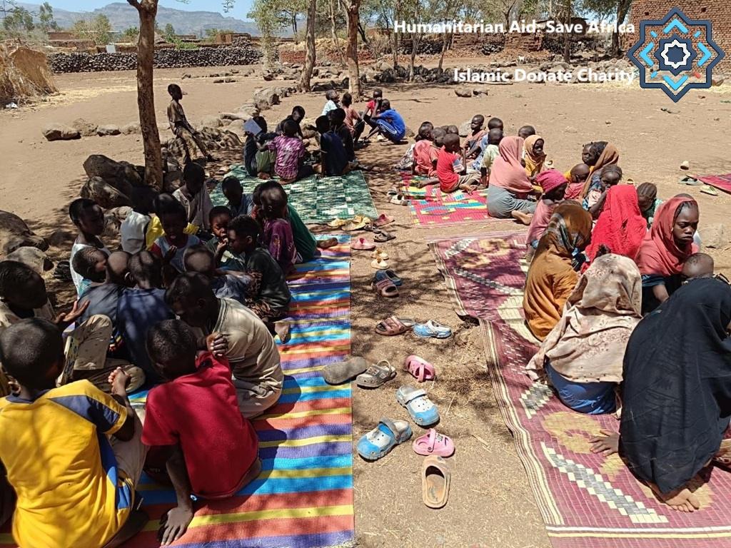 Help Eritrea kids sitting for food relief Humanitarian Aid Save Africa funded by TRX via Islamic Donate Charity education.
