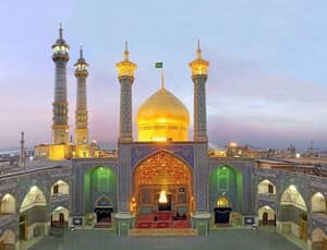 Grand mosque with golden dome and minarets under a twilight sky, showcasing intricate mosaic tilework and arched doorways. Donations accepted via ETH.