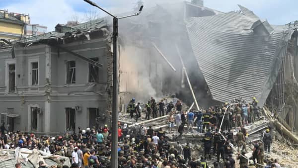 Kyiv children's hospital attack aftermath with rescue workers amid rubble. Crypto donations of medical supplies and food for Ukraine are urgently needed, potentially via ETH.