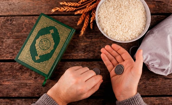 Khums year calculation with Quran, rice, coins, and a donation bag. Pay Khums on surplus income for purified wealth. Donate via crypto like USDT.