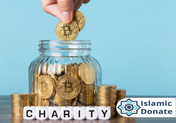 A hand places Bitcoin coins into a jar labeled CHARITY. Stacks of gold coins and the Islamic Donate logo are visible, signifying crypto donations for Islamic charity.