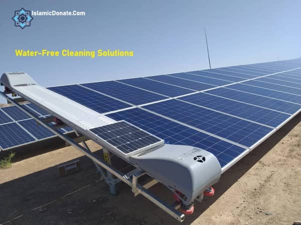 Water-free solar panel cleaning robot in operation in a desert environment, conserving water and enhancing renewable energy projects, supported by SOL donations.