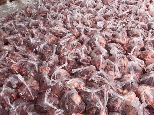 Relief Qurbani donations of meat in plastic bags, supporting global food security through crypto aided charitable giving via USDT.