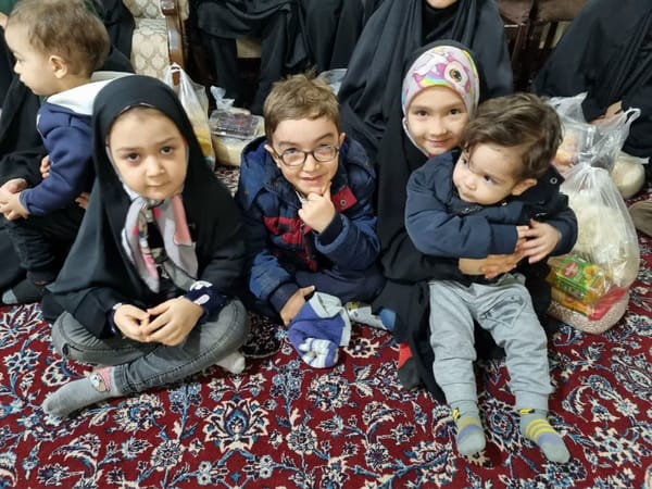 Children in traditional Islamic clothing sit together, receiving aid during Ramadan 2025, a testament to the strength and resilience of women, with support likely facilitated by crypto donations like USDS.