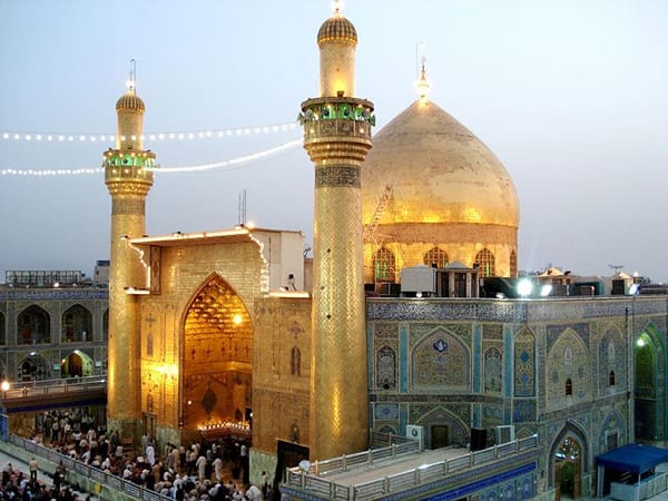 A stunning gold-domed mosque with minarets, a symbol of Islamic heritage, reflecting the principles of charitable giving and leadership embodied by Imam Ali. Donation via cryptocurrency like BTC honors this legacy for swift and transparent aid.